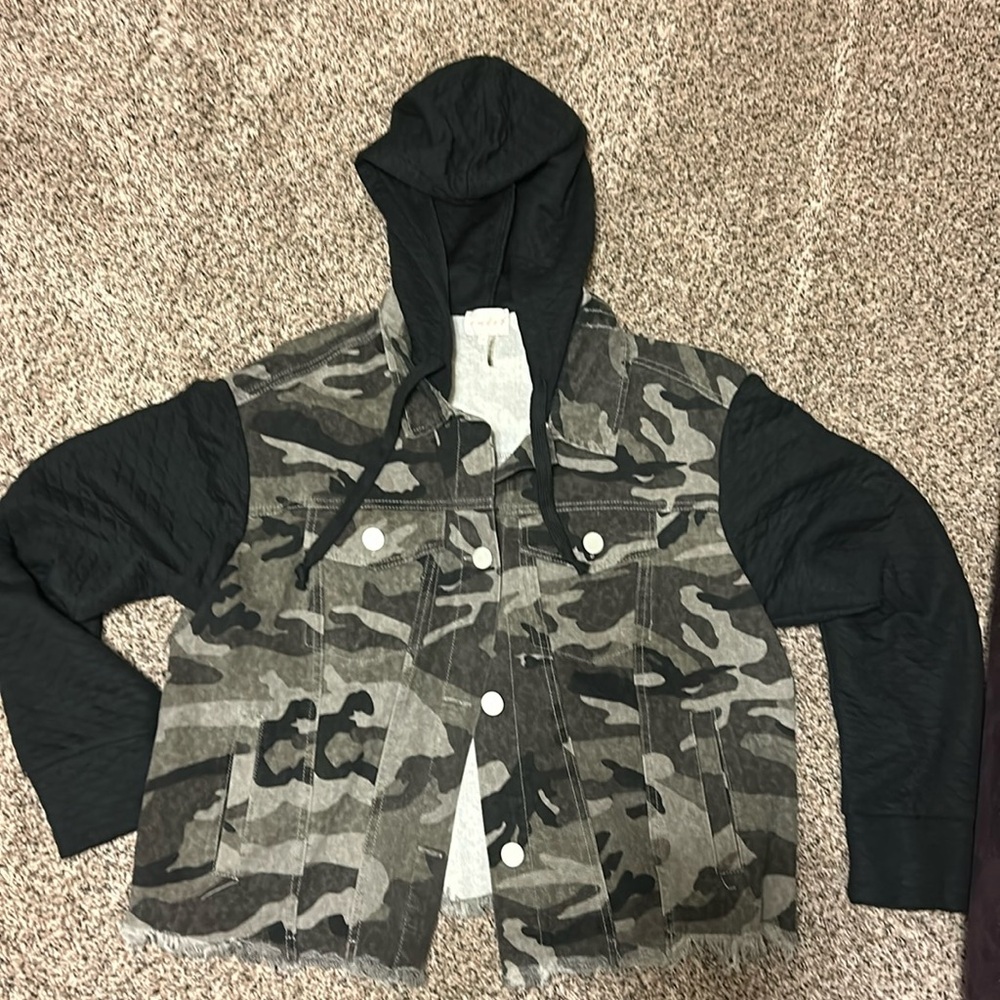 Black and gray camouflage jean jacket with quilted black sleeves and hood